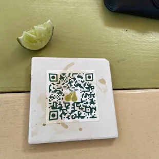 Menus are accessible from QR code coasters on the tables
