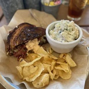Half of a Ruben chips and the best potato salad I have ever had.