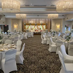 Room decor and setup for a ceremony and reception