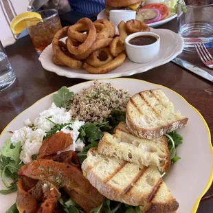 Arugula salad with quinoa, delicious feta, red peppers and grilled bread.