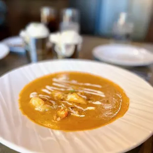 Pan roast - crab meat, shrimp, and lobster meat in tomato cream sauce, served with rice