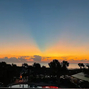 the sun setting over the ocean