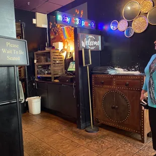 a woman standing in a restaurant