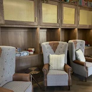 two chairs and a bookcase