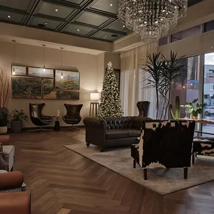 a living room with a christmas tree