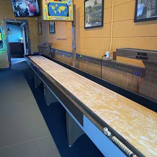 Epic shuffleboard table. Perfect for passing the time while people watching and enjoying a beer.