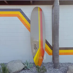 a surfboard leaning against a building