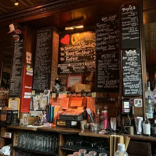 a bar with a menu on the wall