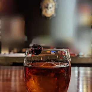 a drink in a glass on a napkin