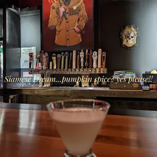 a shot of a drink sitting on a bar