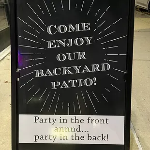 a sign that reads come enjoy our backyard patio