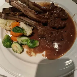 Rack Of Lamb Roasted To Your Specifications And Served With A Rich Burgundy Demi - glace