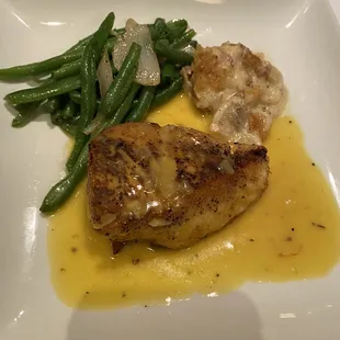 Chilean Sea Bass Served With A White Wine And Lemon Saffron Sauce