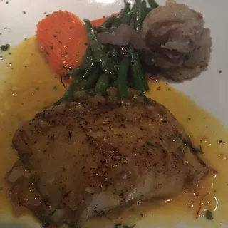 Chilean Sea Bass Served With A White Wine And Lemon Saffron Sauce