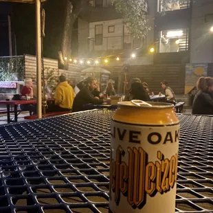 a can of beer sitting on a table