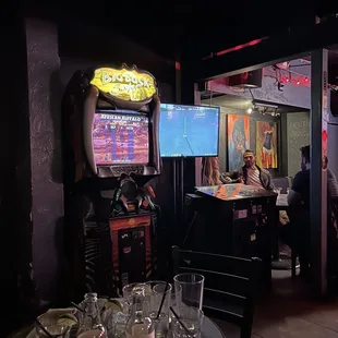 people sitting at tables in a bar