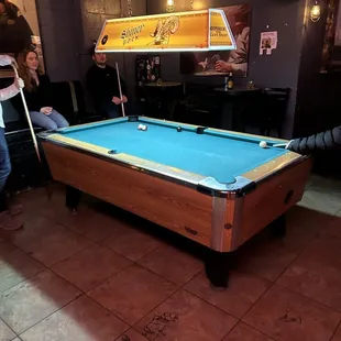 a pool table in a bar