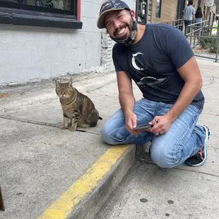 This cats always outside chilling the Liberty every time I go there or walk by! He's become an icon!!