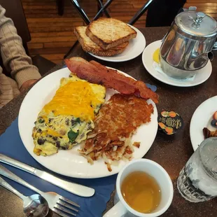 Spinach omelet with hashbrown and bacon