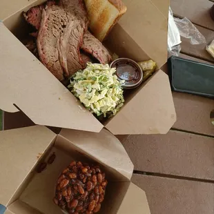 two boxes of barbecue food
