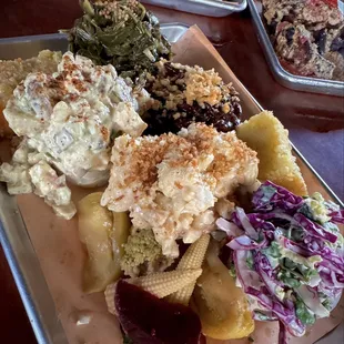 The sides; collard greens, potato salad, bourbon apple bacon beans, mac &amp; cheese, with truffle crumbs, cornbread and coleslaw