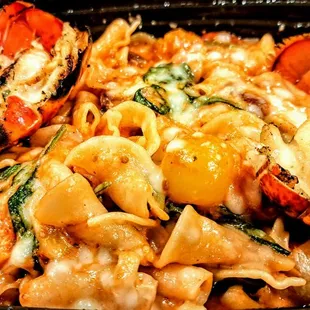 Lobster alla Vodka: Maine lobster, campanelle, spinach, pearl onion, roasted tomato, spicy tomato cream, Parmigiano-Reggiano. $38.00