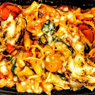 Lobster alla Vodka: Maine lobster, campanelle, spinach, pearl onion, roasted tomato, spicy tomato cream, Parmigiano-Reggiano. $38.00