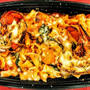 Lobster alla Vodka: Maine lobster, campanelle, spinach, pearl onion, roasted tomato, spicy tomato cream, Parmigiano-Reggiano. $38.00