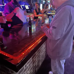 a man standing at the bar