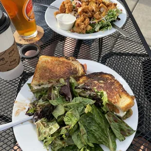 two plates of food and a drink