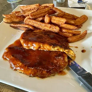 Blackened chicken with bourbon glaze and sweet potato fries