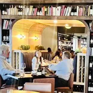 a group of people sitting at a table