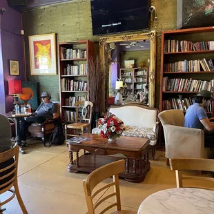 people sitting at tables in the library