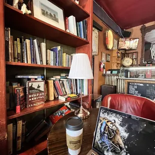 a laptop and a coffee cup on a table