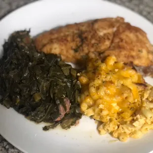 Fried red fish with Mac and cheese and greens.
