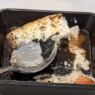 Cheesy thing in an iron skillet. "Rich"