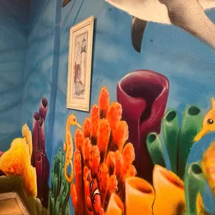 a mural on the wall of a restaurant