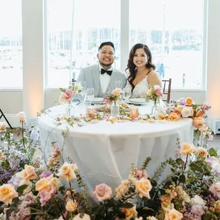 Our sweetheart table backdrop was the gorgeous marina and large windows!