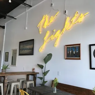  neon sign that reads the lights cafe