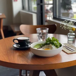  bowl of food and a cup of coffee