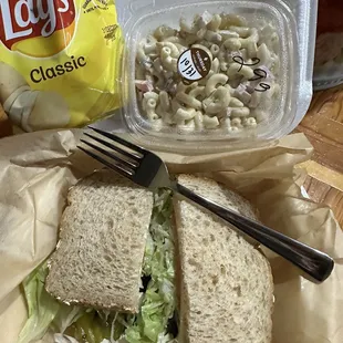 Tuna salad sandwich, macaroni salad and chips
