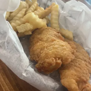 a basket of fried fish and chips