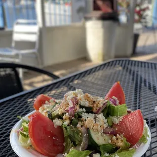 a plate of salad on a table