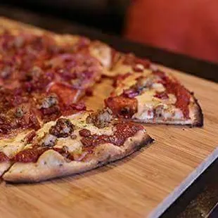 a pizza on a cutting board