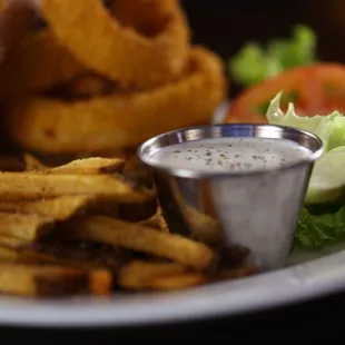 a plate of french fries and a salad