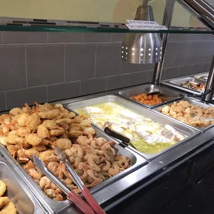 a buffet with many different types of food
