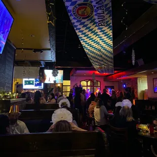 a crowd of people sitting at tables