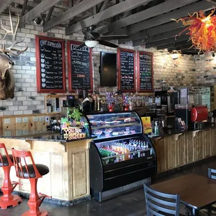 a restaurant with a brick wall