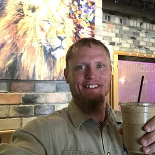 a man holding a drink