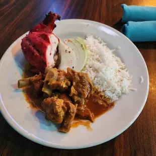 Goat curry, basmati rice, and chicken tandoori . Delicious!